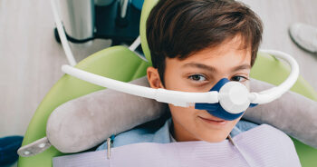 Child receives sedation dentistry before his treatment.